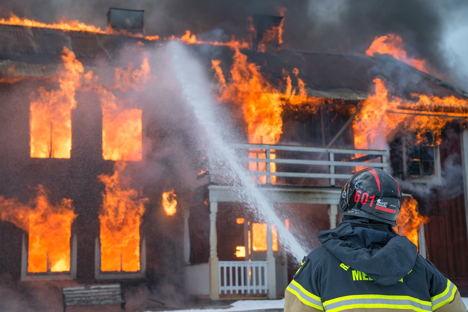 A firefighter tackling a building fire