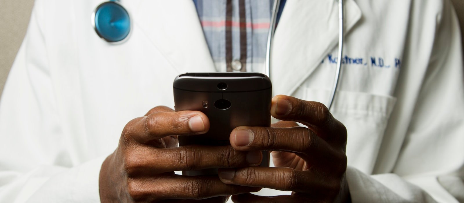 A healthcare professional with a stethoscope, representing employee health cover